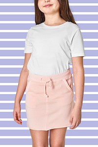 Woman in white t-shirt and pink skirt