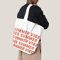 White tote bag psd mockup with summer vibes typography fashion shoot