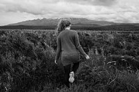 Woman walking in nature, gray photo