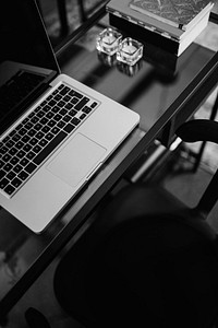 Neat workstation, laptop on table in black and white