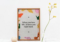 Wooden picture frame mockup psd with motivational quote on ripped paper collage background