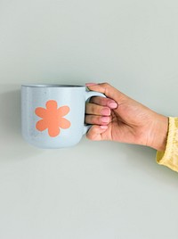 Holding ceramic mug mockup psd