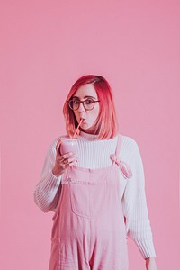 Pink woman drinking smoothie photo