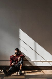 Black man using smartphone, social media photo