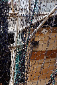 Fishing nets drying in the summer sun at the harbor
