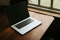 Digital laptop on a wooden table