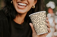 Cup mockup psd on woman's hand