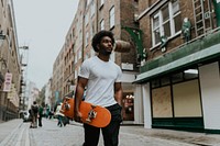 Man carrying skateboard, hobby, lifestyle photo