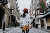 Woman carrying skateboard, hobby, lifestyle photo