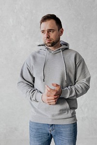 Man wearing a gray hoodie mockup