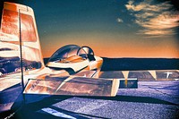 Retro combat aircraft, sunset background