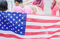 American flag with women wearing pink