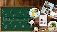 Breakfast meal on a wooden table and blackboard with vegetable icon