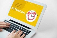 hands with illustration of alarm clock notification for important appointment on laptop