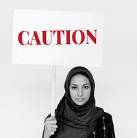 Woman hold caution alert sign