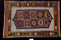 Hearth rug, Yomud type. A white field sewn with small stars (?) ('checkerboard') contains a badly designed hexagonal medallion, which in turn contains ten octagon shapes in various colors. The hearth field is enclosed by a reciprocal sawtooth band in three shades. Three borders, the main one made up of geometric single flowers divided by three triangles laid end to end. Ends-narrow web with loose warp threads. Sides-over cast with different colored yarns. Ghiordes knot.. Original from the Minneapolis Institute of Art.