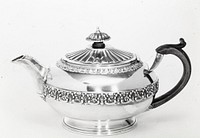 teapot, round, decorated at top and around the middle with a band of strap mount work in leaf and grape design; the spout is joined to the body by a shell shape, and the cover and finial are decorated with radiated fluting; the finial is also gadrooned around the edge; wooden handle attached to body by wedge-shaped piece of silver. Original from the Minneapolis Institute of Art.