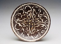 Terra cotta plate with conventionalized floral design in very dark brown on white ground. Repaired, but no restoration.. Original from the Minneapolis Institute of Art.