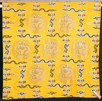 curtain hanging of imperial yellow brocaded satin. design of seven gold-cloud medallions, each with a five-clawed dragon grasping the heavenly jewel, in a field of large, loose clouds in shades of blue, green, pink, red, peach, and dull orange. Hanging made up of three widths seamed lengthwise. at lower right corner an applied strip of sriped grosgrain ribbon. lining of orange silk in all-over leaf and flower design.. Original from the Minneapolis Institute of Art.