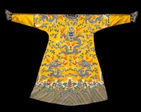 Imperial robe of yellow satin embroidered by couching narrow strips of braided silk in shades of blue, rose, pink, green, yellow, mauve, aubergine, and red to the ground. Nine five-clawed dragons in blue with accents of red, pink, and white. Loosely drawn clouds on ground. Border of slanting wavy stripes in above colors with clouds separating stripes from rolling waves across which a group of bats fly to left and right of central mountain motif. Upper section of border design repeated at elbows of sleeves which are finished with a section of blister-ribbed satin terminating in dark blue satin cuffs embroidered with a dragon, clouds, etc., in same technique as body of robe. Collar and front band of same dark blue edged with narrow band of blue and gold brocade. Coat slit at sides and lined with thin yellow silk having good luck design on a fretwork ground.. Original from the Minneapolis Institute of Art.