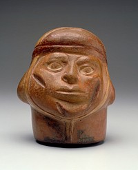 Portrait vase representing the head of warrior with three scars on his face. The head is closely wrapped in a scarf that ties under the chin and is bound by a band around the forehead. The expression of the face reflects clearly the suffering of the wounded man.. Original from the Minneapolis Institute of Art.