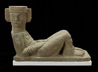 Sculpture determined to be a copy of a work from Chichen Itza, Yucatan Peninsula. Reclining figure resting on elbows, head turned sharply to right, legs drawn up and feet resting flat. The hands are placed on the thighs. Flat, cap-like headdress with elaborate ear ornaments carved only in front. Large pectoral, wristlets resembling three rows of fringe, anklets, thonged sandels. Right knee cap restored, lower neck restored, left hand restored, right hand cracked. The base is chipped near the left foot, and a piece is missing at the left corner below figure's shoulder. Authenticity in doubt: 1975.. Original from the Minneapolis Institute of Art.