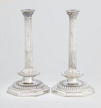 a pair of exceptionally rare, unusually large sized William and Mary candlesticks; plain octagonal bases, with large bold gadroon above, fluted columns with gadroon at the base, the upper part of the columns surmounted with leaves, removable bobeche. Original from the Minneapolis Institute of Art.