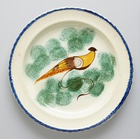 Plate, ceramic-porcelain, decorated with yellow bird in center, narrow blue band around edge; previously catalogued as one of a pair. Original from the Minneapolis Institute of Art.