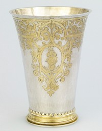 parcel gilt beaker of tapered cylindrical form, engraved with foliate strapwork, enclosing three cartouches of male and female figures, moulded foot with corde band and serrated edge, engraved beneat with armorials, silver gilt. Original from the Minneapolis Institute of Art.