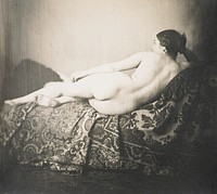 female nude lying on side on a couch facing away from the camera, head propped on hand; elaborately woven(?) fabric on couch. Original from the Minneapolis Institute of Art.