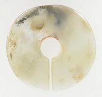 plain surface; translucent white jade with opaque white marks of calcification. The disk shaped object is often identified as a 'chueh'.. Original from the Minneapolis Institute of Art.