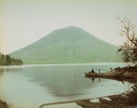 figure in a boat at right on the rocky shore of a calm lake; green mountain in background. Original from the Minneapolis Institute of Art.