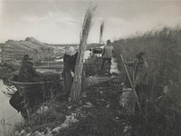 woman at center bundling together long reeds; man at L in a boat with shorter reed bundle; 2 men at R with poles; bundles of reeds stacked at L. Original from the Minneapolis Institute of Art.