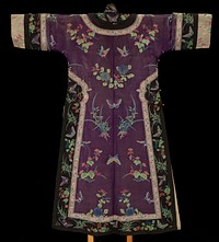 long-sleeved robe; body of purple sheer silk woven with multicolored plants, flowers, butterflies and insects; black sheer silk trim with similar muticolored weaving; pastel-colored additional trims with floral motifs; off-white cuffs and lining. Original from the Minneapolis Institute of Art.
