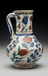 Pitcher; with straight handle; white glaze with floral design in dark blue turquoise blue and tomato red with watery black outlines; tulip, open rose and wild hyacinth; so called Rhodian ware.. Original from the Minneapolis Institute of Art.