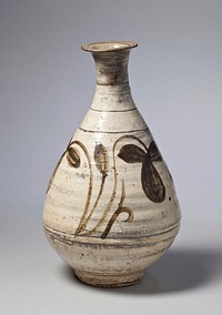 White bottle with looping floral decoration on body; incised lines around base of neck and body; narrow neck, wide body, narrow foot slightly flaring mouth. Original from the Minneapolis Institute of Art.