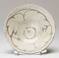 Shallow bowl decorated with brushed white slip; incised abstracted leaf design inscribed and highlighted with darker gray glaze. Original from the Minneapolis Institute of Art.