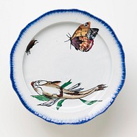 cake plate with white ground and brushed blue pigment around edge of plate and foot with painted fish seen from below, orange butterfly and a beetle on plate surface and a pink flower bud, a bee and snail on foot. Original from the Minneapolis Institute of Art.