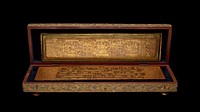 box with hinged lid and 2 hook and eye closures; 4 pairs of knob feet on lid and bottom; gold lacquer carved with organic and geometric patterns and inlaid with clear and colored glass fragments in floral designs; lined with dark blue velvet. Original from the Minneapolis Institute of Art.