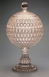 Thumbprint Compote, made by Bakewell, Pears and Company, about 1865, colorless glass, fitted with a dome cover to form a sphere and pressed in a pattern called Argus or Thumbprint.. Original from the Minneapolis Institute of Art.