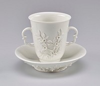 Cup (beaker) with flared sides and double scroll handles, flowering orange blossoms on the side.. Original from the Minneapolis Institute of Art.