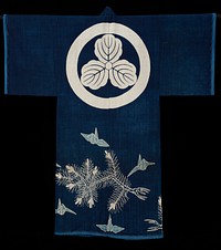 Coverlet in the shape of a kimono; indigo field decorated with cranes and pines and a large crest or medallion on the top of the back. Original from the Minneapolis Institute of Art.
