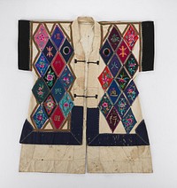 plain light blue body with batik cuffs, shoulder and collar trim; embroidered lower back panel which extends into long tail. Original from the Minneapolis Institute of Art.