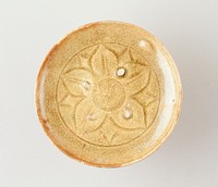 shallow dish; light green glaze; five pedal floral motif at center of bowl within a circle; four raised knobs inside bowl. Original from the Minneapolis Institute of Art.