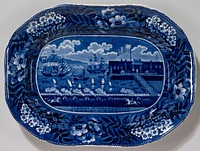 platter; pottery not porcelain ; soft-paste porcelain with a commemorative scene of Lafayette landing in new york(1824) in transfer-printed underglaze blue. Original from the Minneapolis Institute of Art.