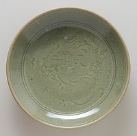 plate, footed, with incised design of foo dog at center and lotus petal motif circling foot; celadon, ceramic, maker Hsien Lu. Original from the Minneapolis Institute of Art.