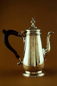 coffeepot with lighthouse body with flared foot and cast spout with shell motif on base of spout; modified urn finial; mahogany handle. Original from the Minneapolis Institute of Art.