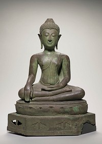 Buddha, bronze seated figure in attitude of contemplation, also known as the Mudra, or position of 'calling the earth to witness'. The green bronze pedestal is in two tiers; the upper one shows lotus leaves in relief beneath a beaded rim, and the lower, (broken at right side) with ovoid indentations, some of them perforated. The ears are weighted but unadorned. The hair is short, in spiky curls and the usnisa had indentation to hold flame, which is missing. The eyes are enameled, proving the figure to be a late piece.. Original from the Minneapolis Institute of Art.