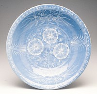 blue and white, decorated in white slip on a sofe blue ground with thre bold chrysanthemum heads amongst feathery foliage. Original from the Minneapolis Institute of Art.