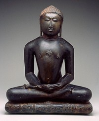 figure seated in dhyanasana with hands in lap; cushion below figure carved with foliate sprays and central quatrefoil medallion; crest ornamented with a diamond-shaped srivatsa; back uncarved. Original from the Minneapolis Institute of Art.